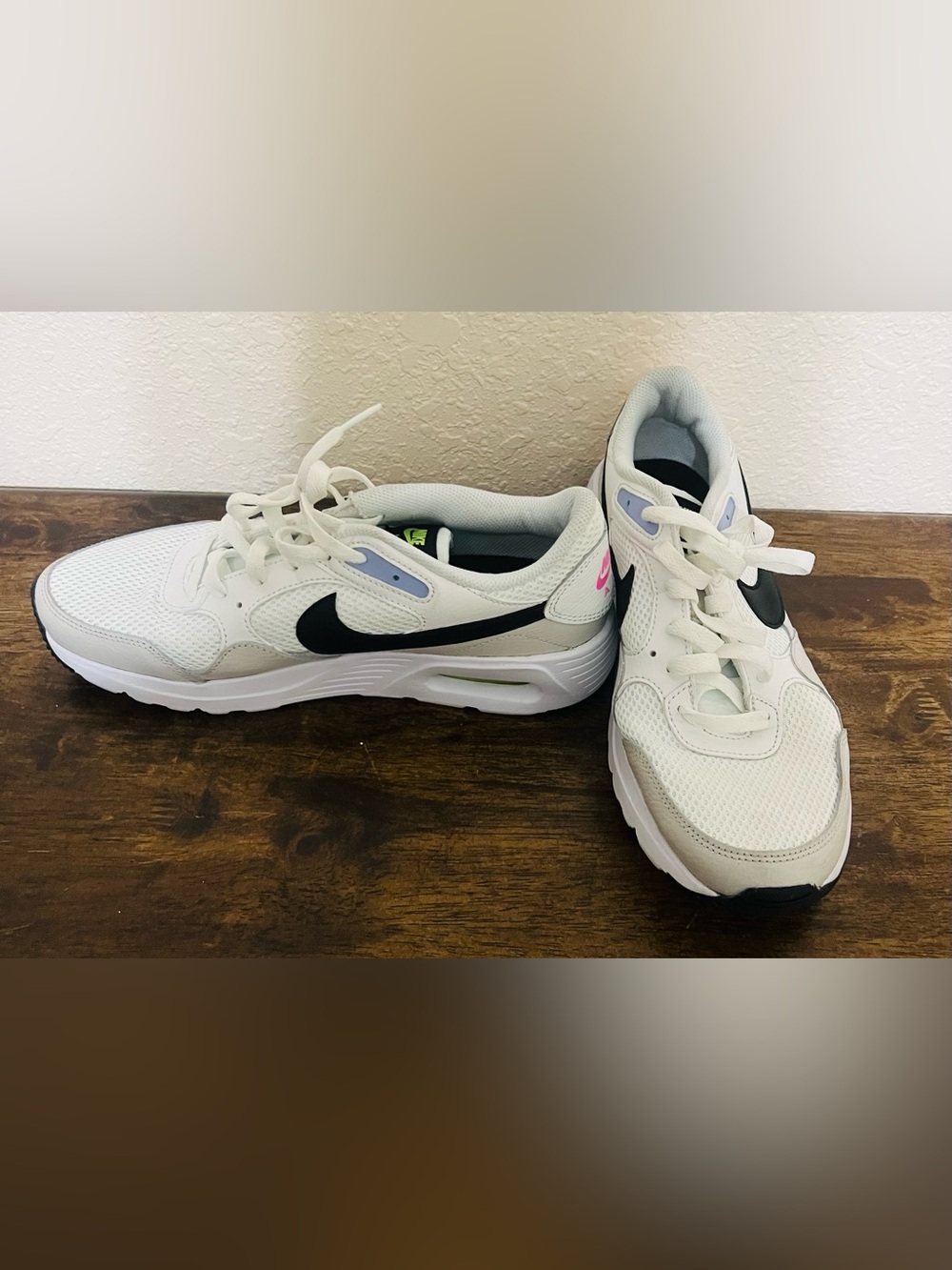 Nike White Sneakers with Black Swoosh and Pink Heel Accent